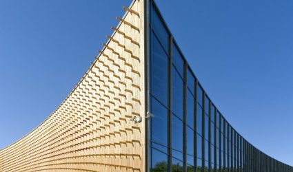 modern-university-buildings-wooden-beams-projecting-from-a-curved-wood-cladding.jpg